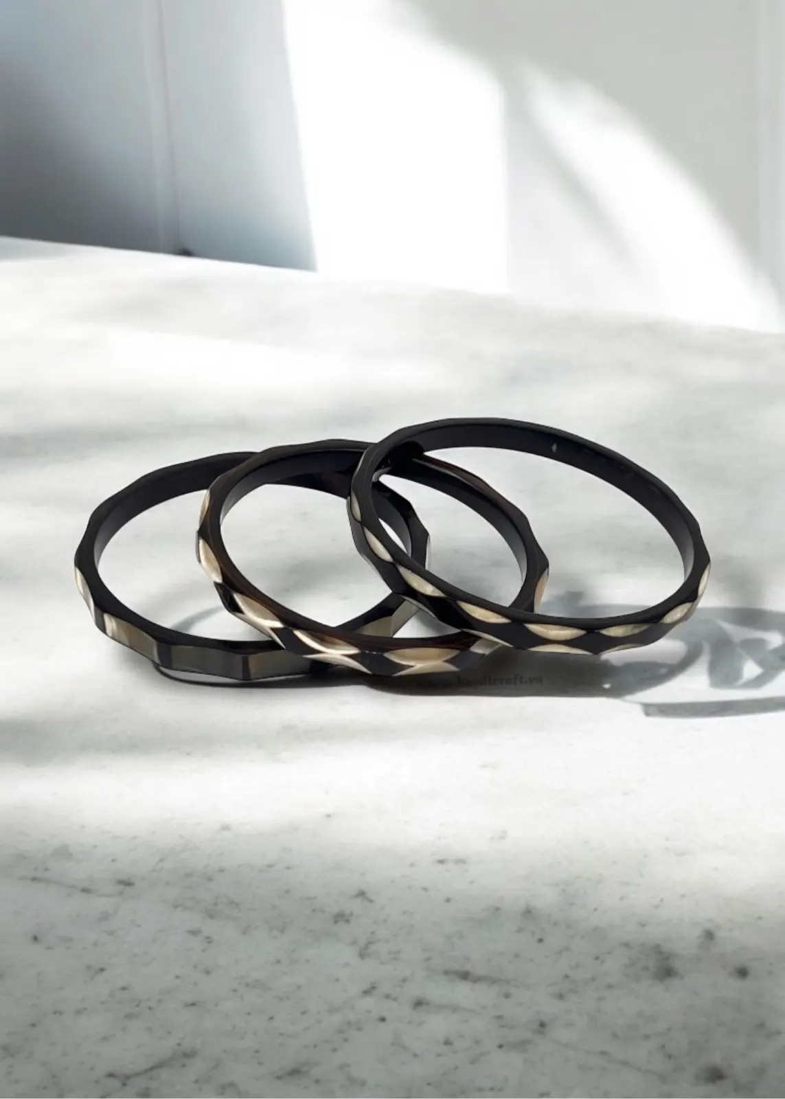 Dark horn bangles with gold lacquer lines