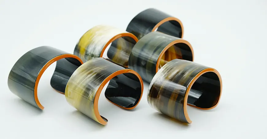 Horn cuffs with orange lacquer edges