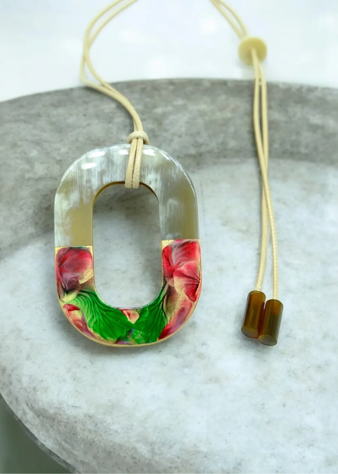 Horn pendant with floral lacquer on stone